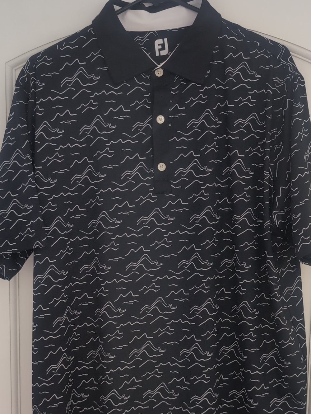 FootJoy Black Golf Polo with White Wave Pattern ⛳